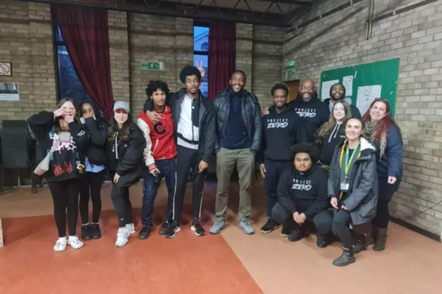Leyton Orient footballer Omar Beckles poses with young people at our Chingford Space4All youth hub