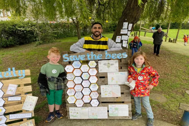 Teacher and children at a climate stall 