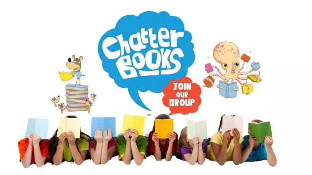 A row of children lying on their fronts reading books with the logo of the Chatterbooks club