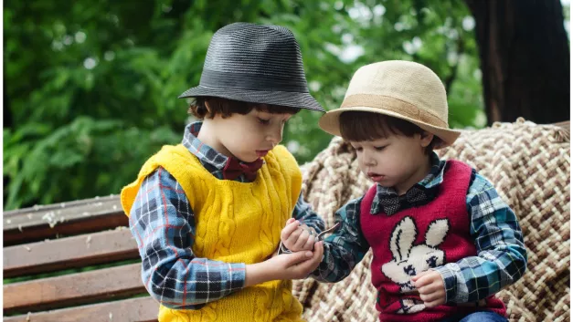 Two children wearing hats