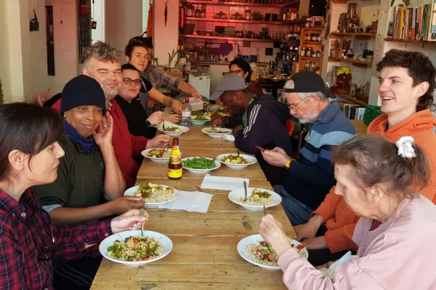 A group of adults enjoying lunch at the Gleaners Café