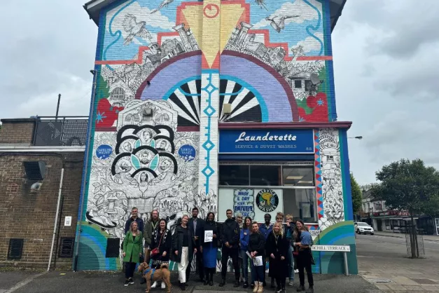 A group of people standing in front of the new mural in Chingford Mount