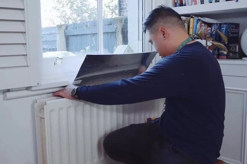 Man fixing radiator