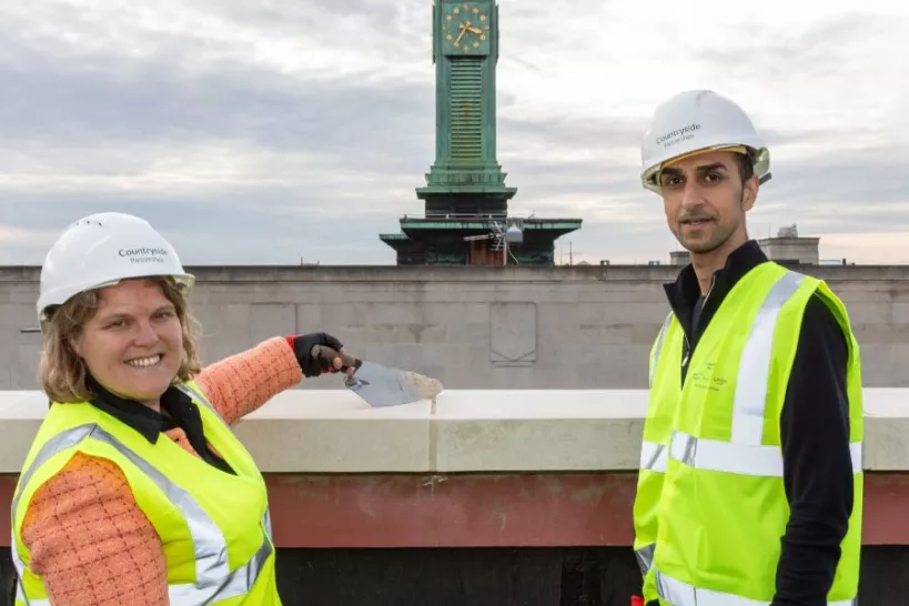 Cllr Williams and Cllr Khan grouting a stone at the top of Hepworth place