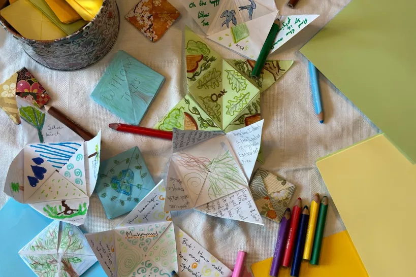 Puzzle purses and coloured pencils on a table